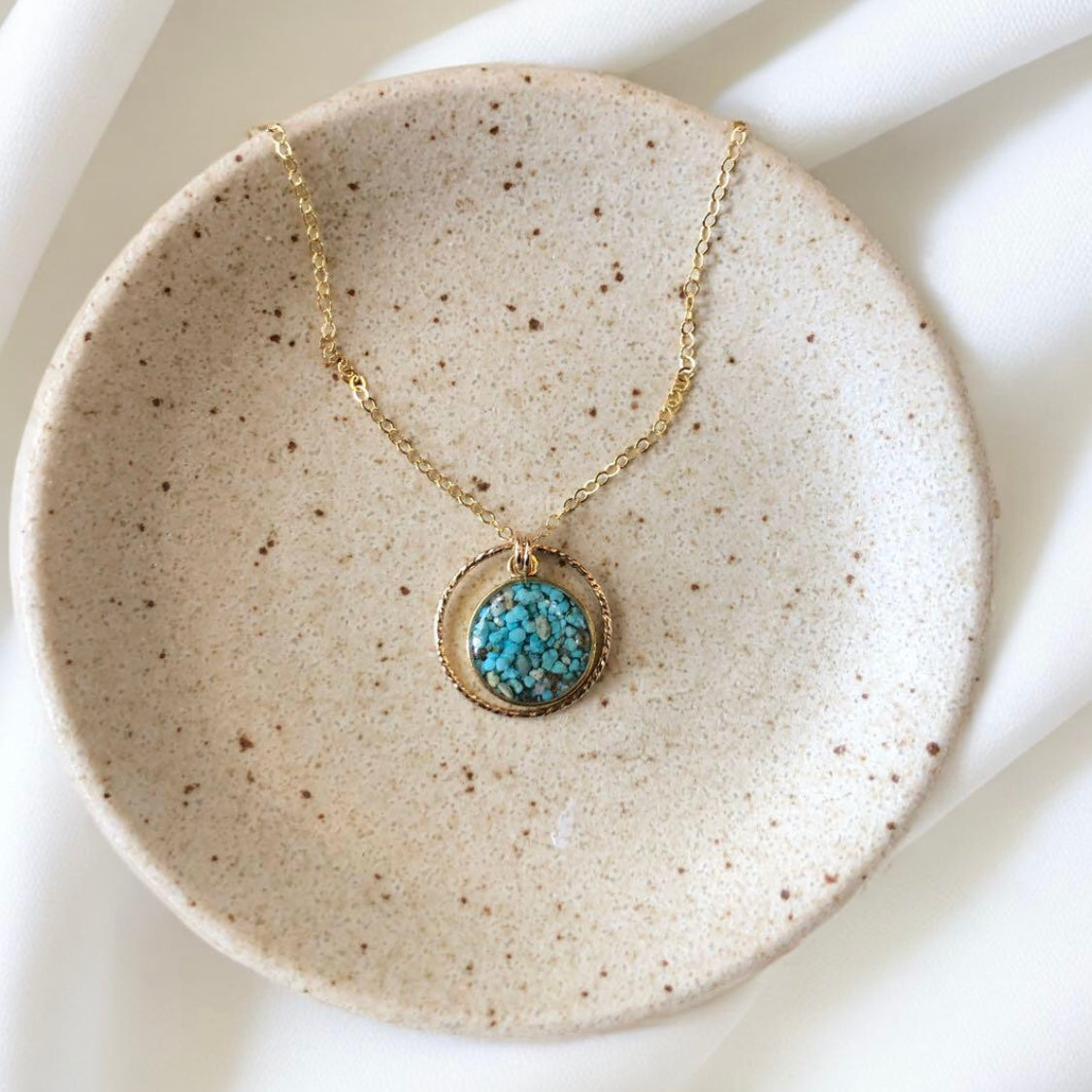 June & Simple Circle of Love Turquoise Necklace — close-up of turquoise circle pendant