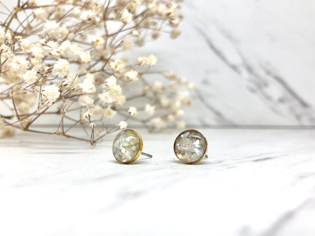 June & Simple Circle Mother of Pearl Studs — pair flat lay on white background