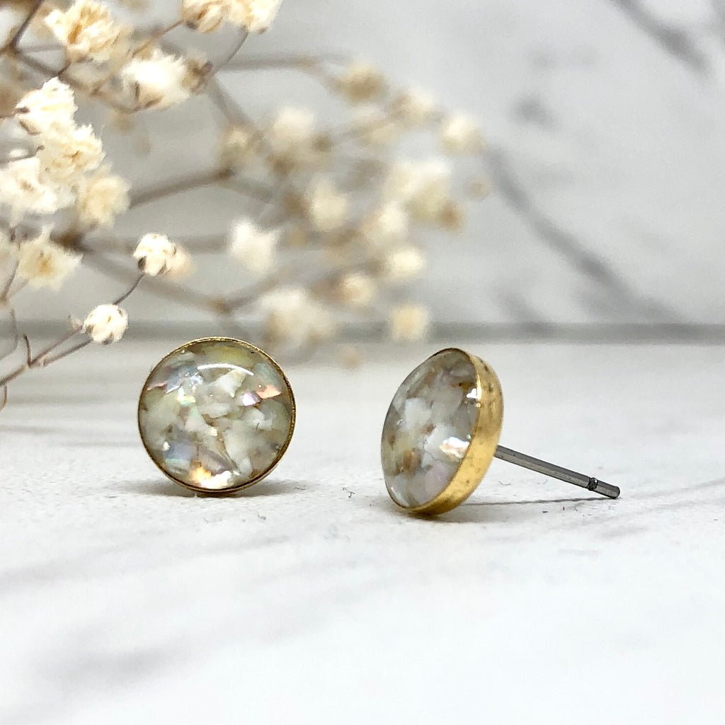 June & Simple Circle Mother of Pearl Studs — styled on a model