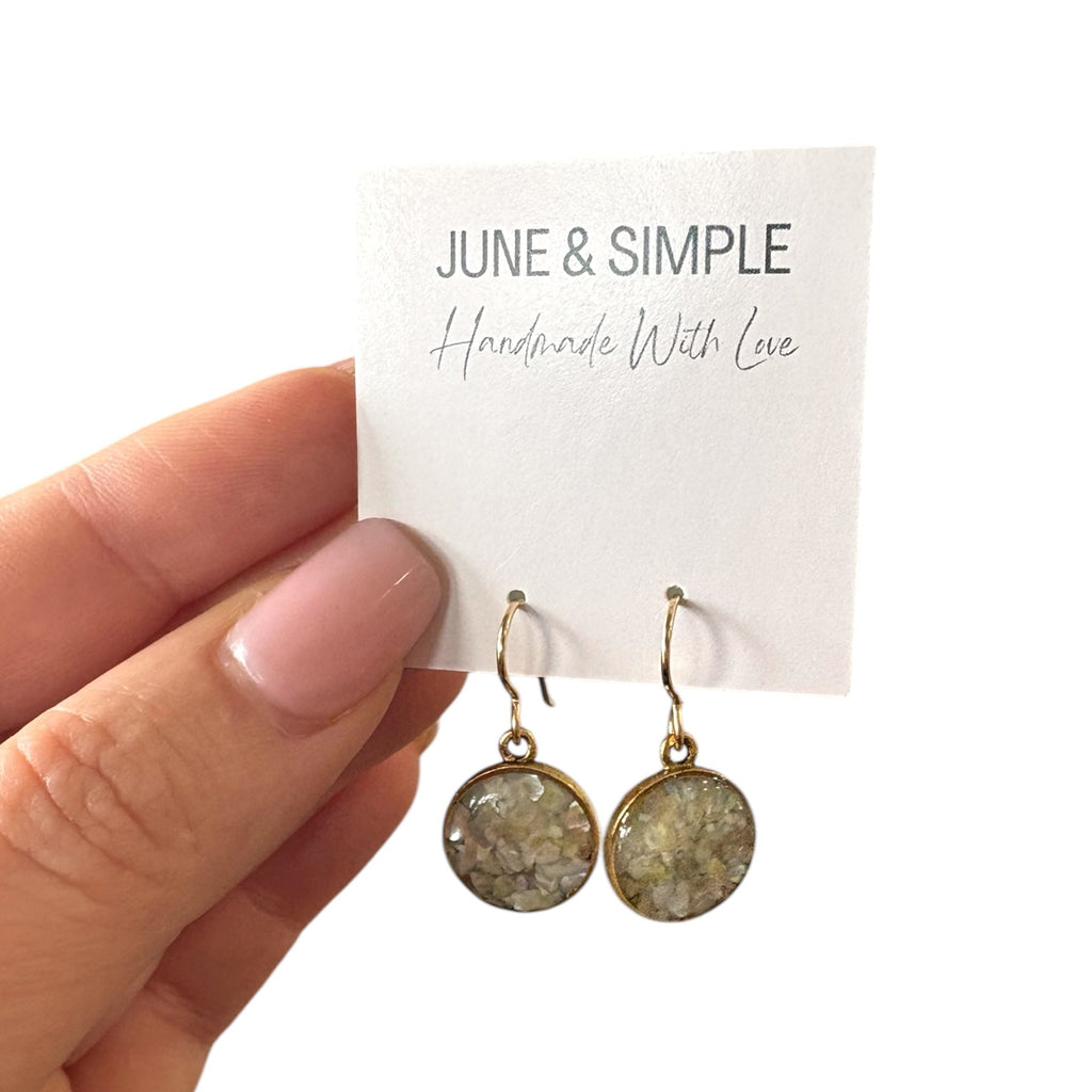 June & Simple Mother of Pearl Circle Drop Earrings — close-up of iridescent mother of pearl circle pendant