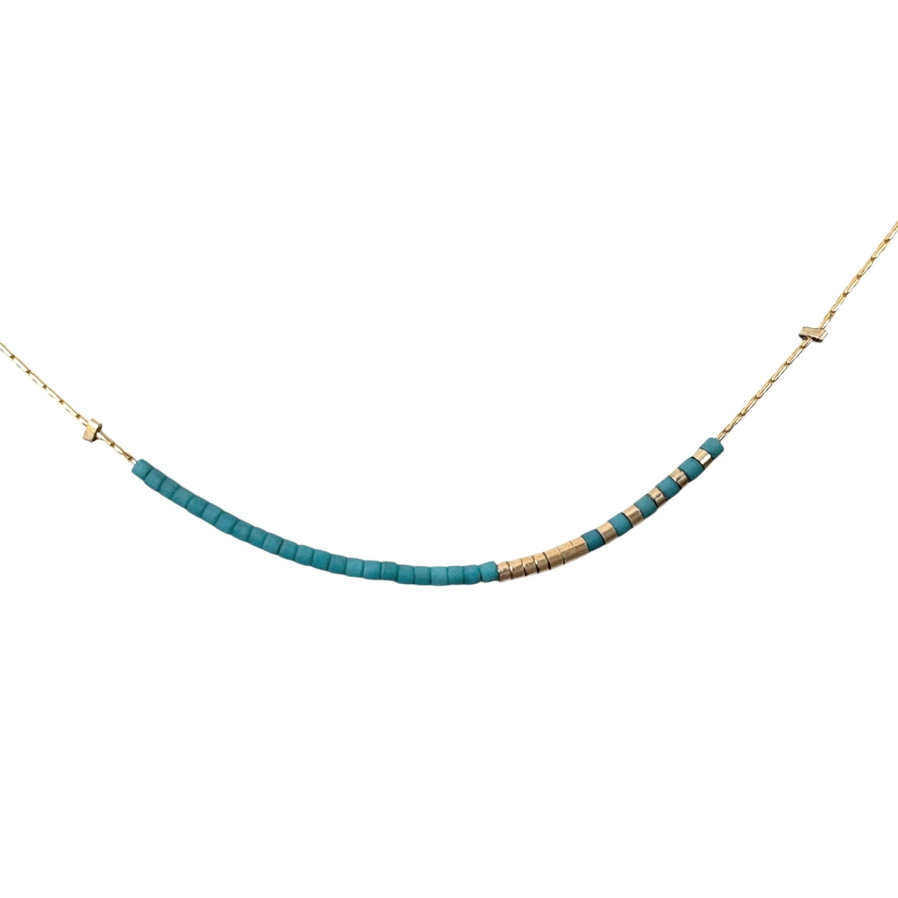 Necklace with blue beads and gold clasp on a white background