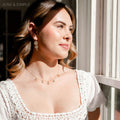 June & Simple Five Mini Gems Mother of Pearl Necklace — five iridescent shell pendants on gold filled chain
