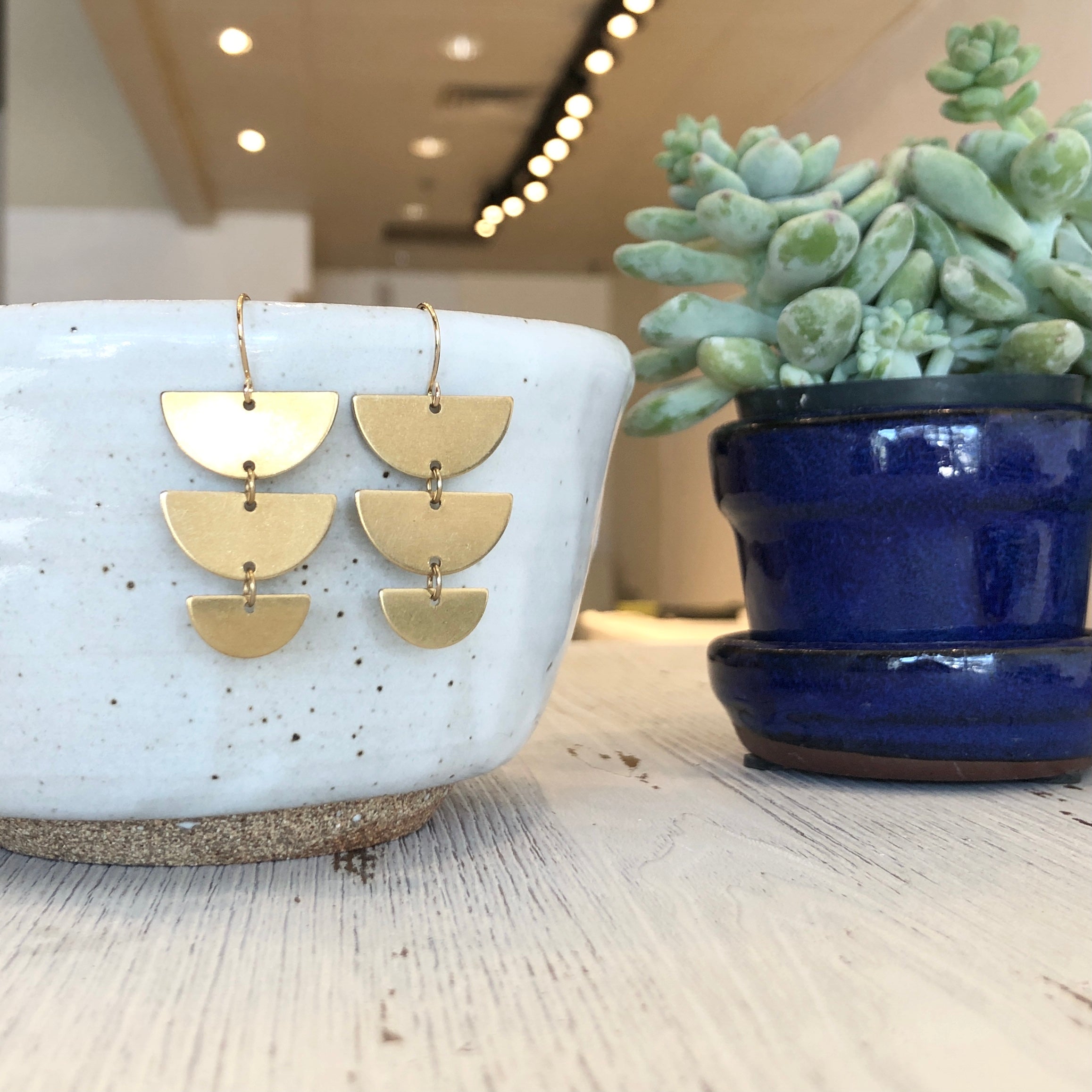 June & Simple Half Moon Earrings — styled on a model