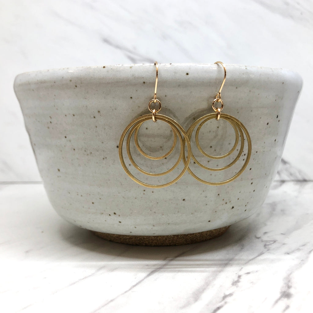 June & Simple Olive Earrings — styled on a model