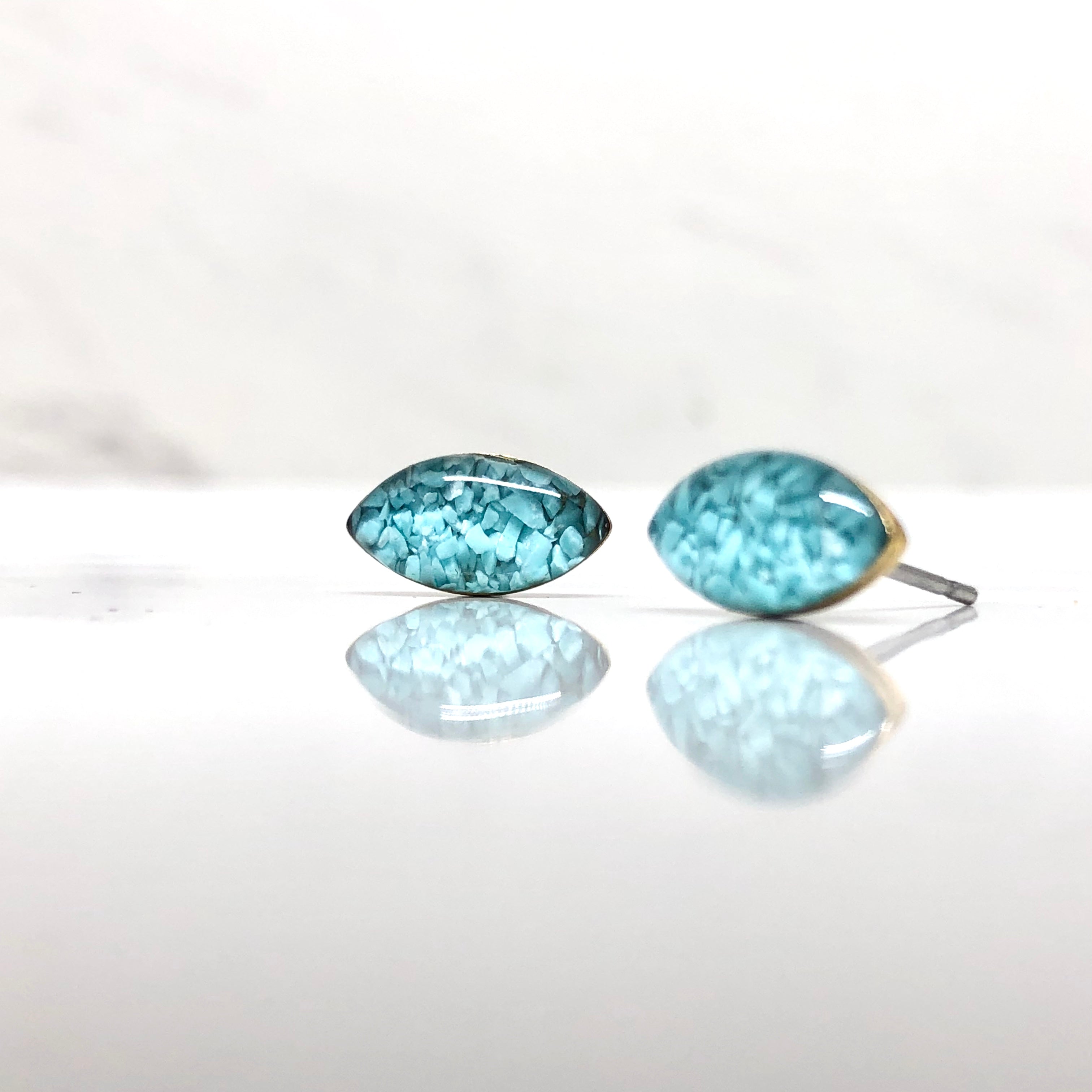 June & Simple Turquoise Studs - styled on a model, close up on ear